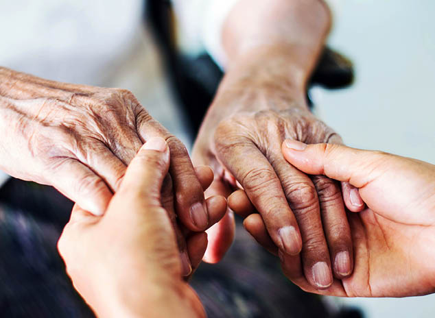Close up hands of helping hands elderly home care. Mother and daughter. Mental health and elderly care concept